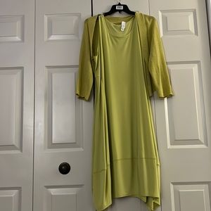 Lime green plus size sleeveless dress with matching shrug that has pockets
